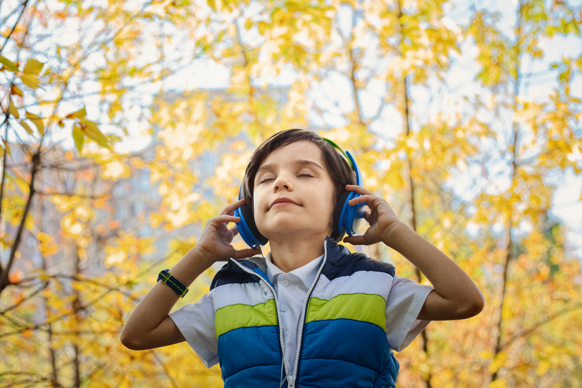 Child Outside with Headphones on